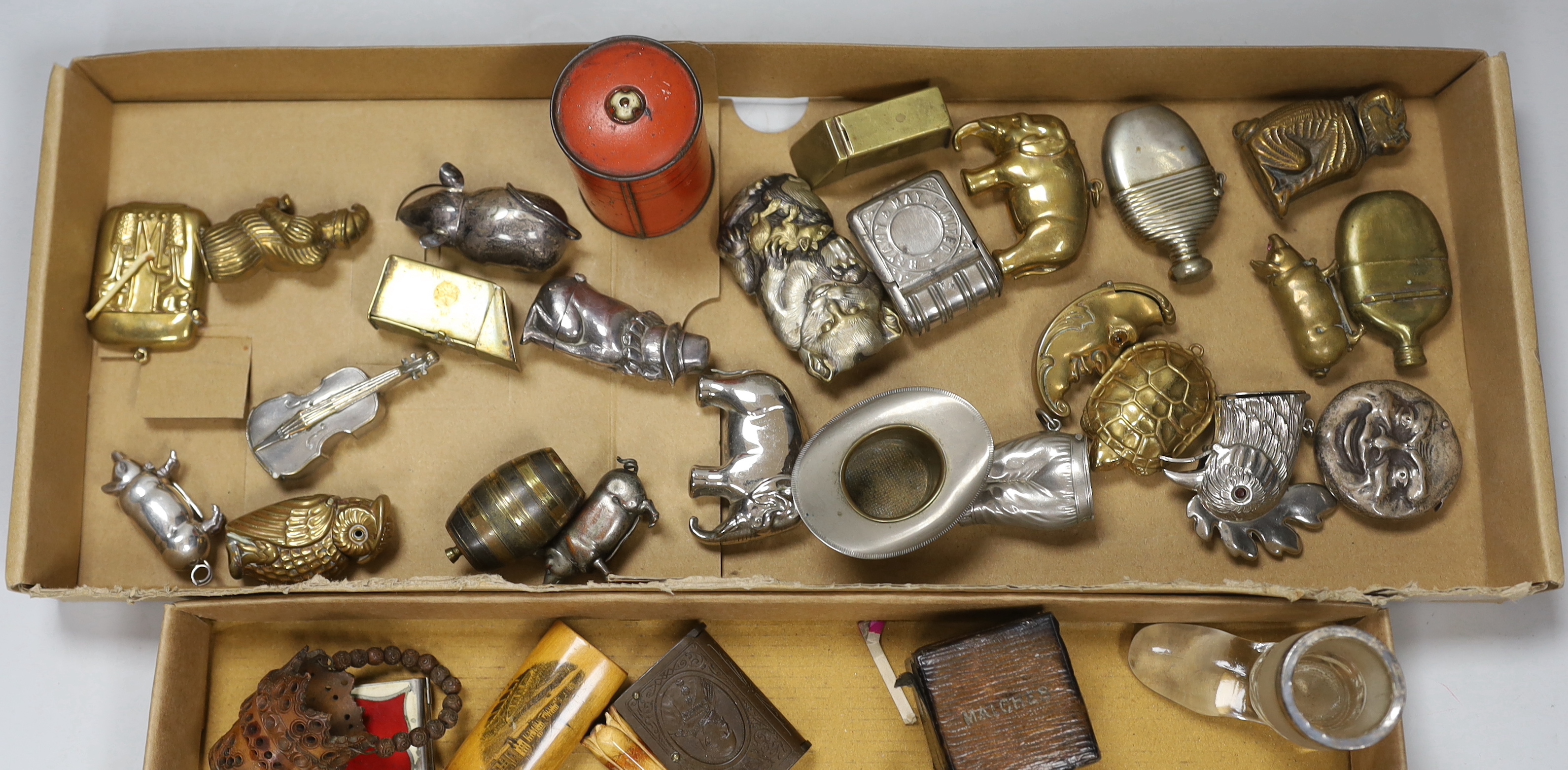 A collection of novelty vestas, matchbox holders etc.